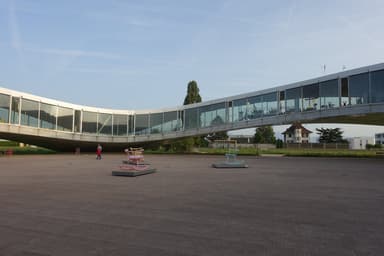 The sweeping contemporary architecture of the Rolex Learning Center at EPFL in Lausanne
